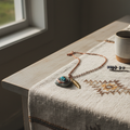 Handcrafted artisan necklace on a clean white surface